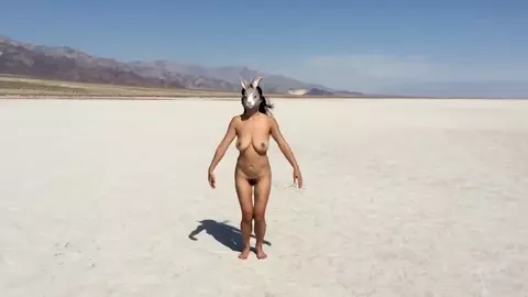 Naked Asian Art Performance of a beach
