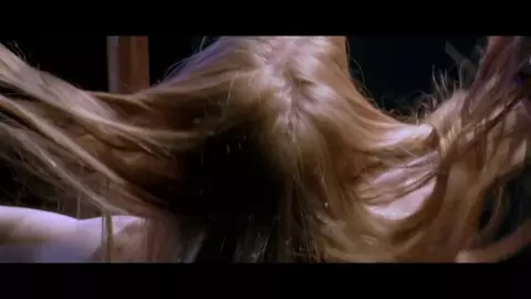 Jessica Chastain moves around pole and pulls dress down showing boobies in Jolene (2008)